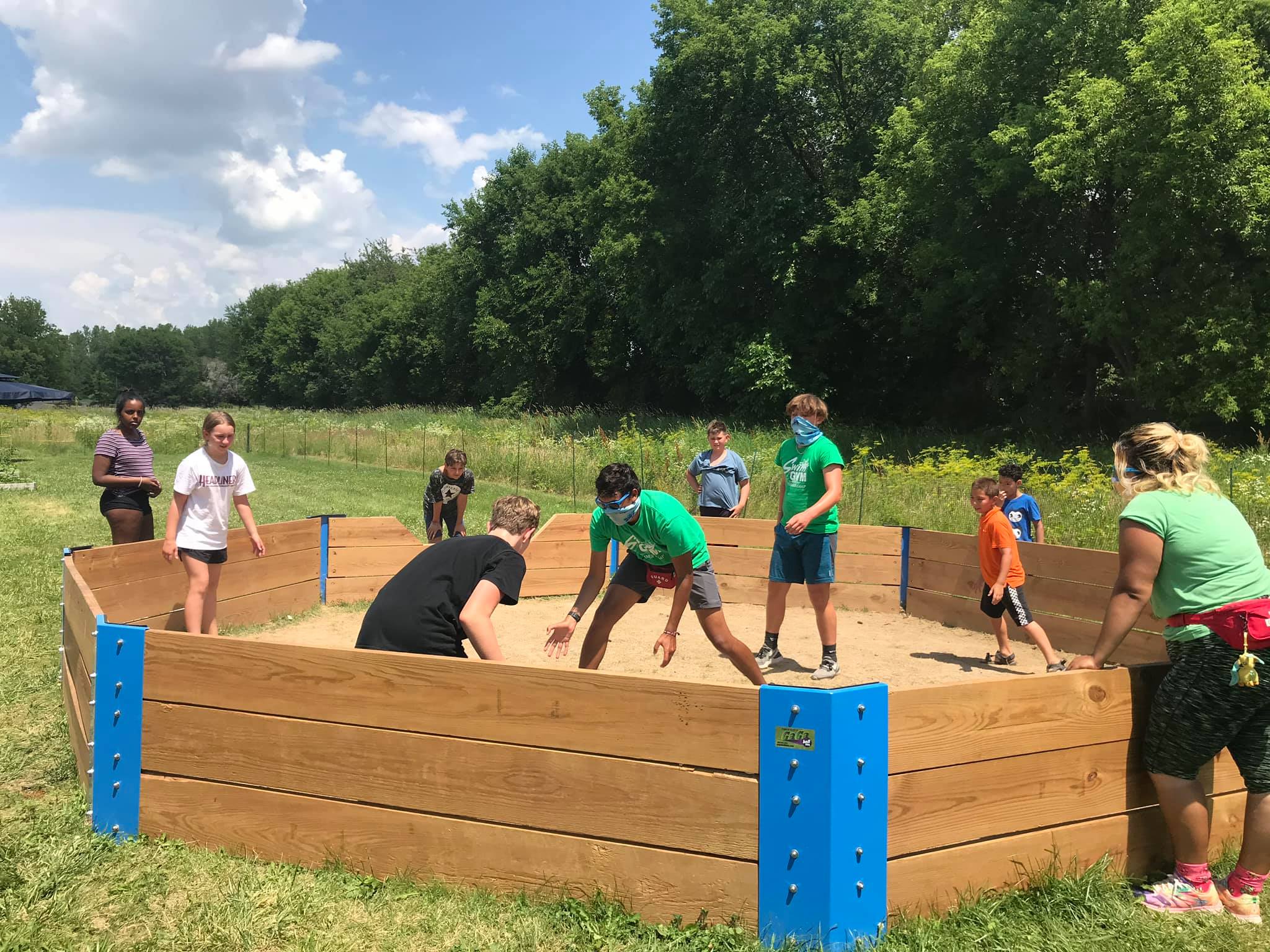 Campers and a counselor playing GaGa ball