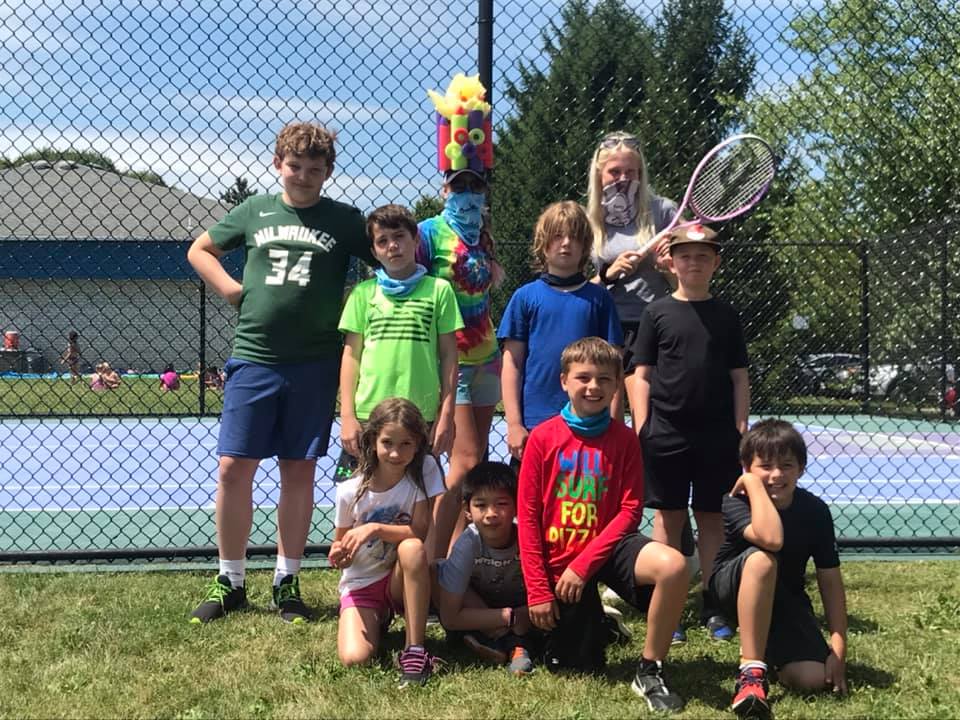 Group photo of Swim&Gym campers outside at camp