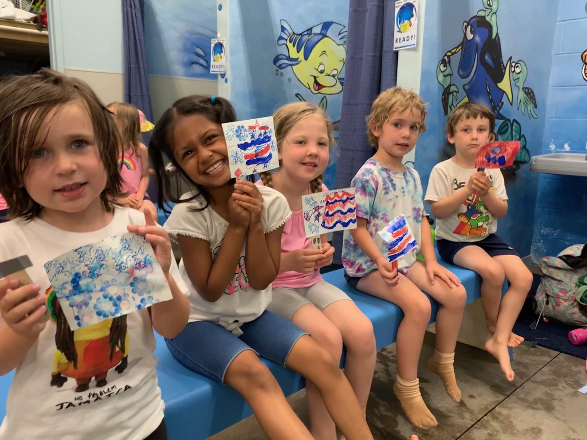 Campers enjoying popsicles together on a hot camp day