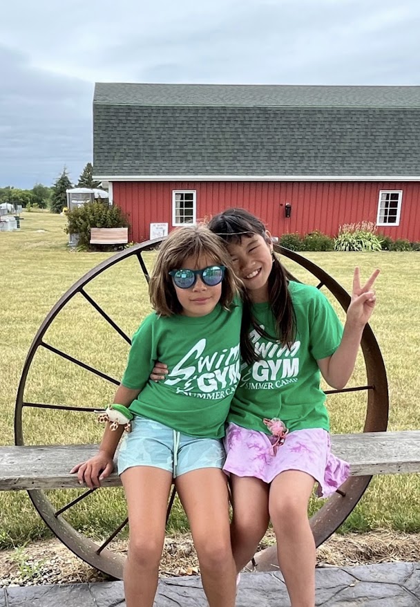 camp girls making friends farm